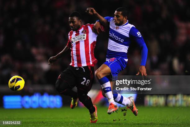 Sunderland player Stephane Sessegnon brushes aside the challenge of Adrian Mariappa on his way to scoring the third Sunderland goal during the...