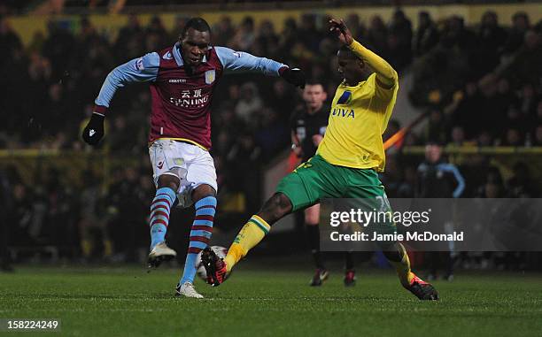 Christian Benteke of Aston Villa scores a goal during the Capital One Cup Quarter-Final match between Norwich City and Aston Villa at Carrow Road on...