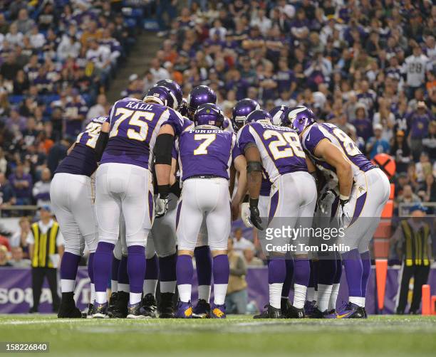 Christian Ponder of the Minnesota Vikings huddles during an NFL game against the Chicago Bears at the Hubert H. Humphrey Metrodome on December 9,...