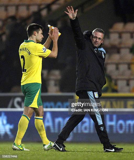 Aston Villa's Scottish Manager Paul Lambert acknowledges supporters at the final whistle of the English League Cup quarter final football match...