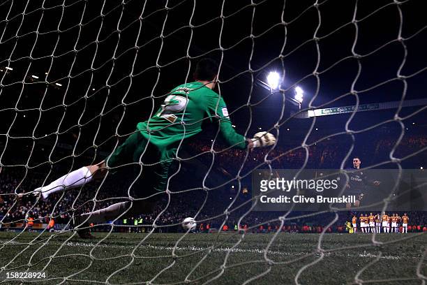 Thomas Vermaelen of Arsenal sees his penalty attempt hit the post to hand his team defeat during the Capital One Cup quarter final match between...