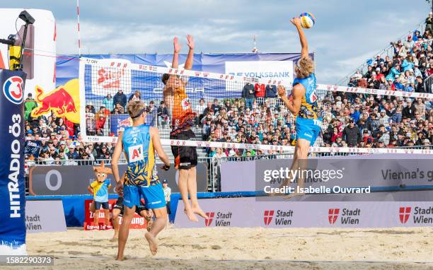 Leon Luini of The Netherlands and David Ahman and Jonatan Hellvig of Sweden during the men's Gold Medal match between The Netherlands and Sweden on...