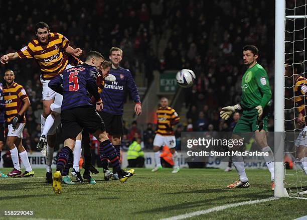 Thomas Vermaelen of Arsenal heads past Bradford goalkeeper Matt Duke to score the Arsenal goal during the Capital One Cup match between Arsenal and...
