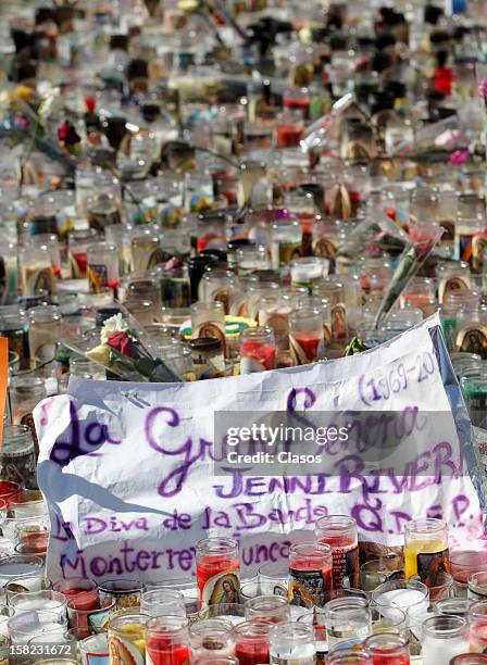 View of hundreds of candles are placed by fans in Monterrey Basilica in memory of singer Jenni Rivera on Tuesday December 11, 2012 in Monterrey,...