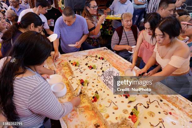 Group of people inside the pitotecnia del Senor del Calvario in the extreme south of Mexico City, on august 06 on the occasion of the Divino Salvador...