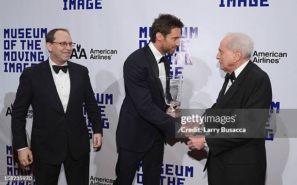 Actor Hugh Jackman greets MMI Director Carl Goodman and MMI Board Chairman television executive Herbert S. Schlosser at the Museum Of Moving Images...