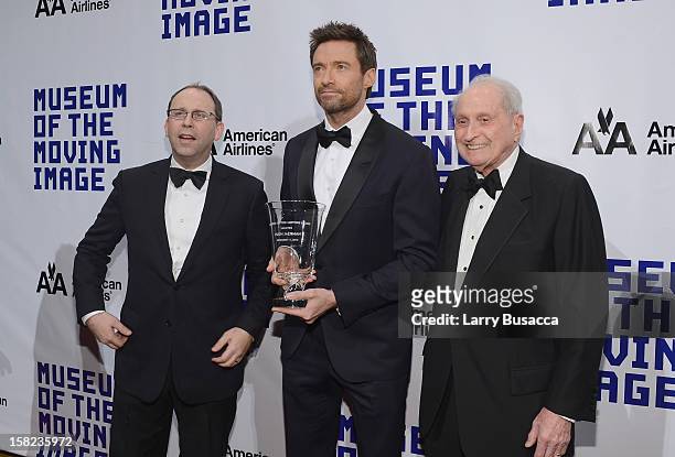 Actor Hugh Jackman poses with MMI Director Carl Goodman and MMI Board Chairman television executive Herbert S. Schlosser and his award at the Museum...
