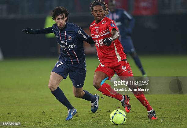 Javier Pastore of PSG fights for the ball with Gaetan Bong of VAFC during the French Ligue 1 match between Valenciennes FC and Paris Saint-Germain FC...