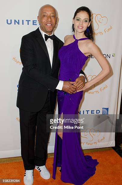 Russell Simmons and Hana Nitsche attend the 2012 Happy Hearts Fund, Land Of Dreams: Mexico Gala at the Metropolitan Pavilion on December 11, 2012 in...
