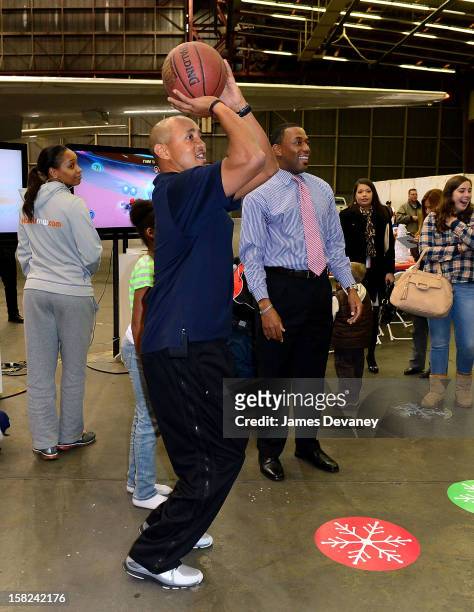 John Starks and Henry Kuykendall attend the 3rd Annual Garden of Dreams Foundation & Delta Air Lines' 'Holiday in the Hangar' event at John F....