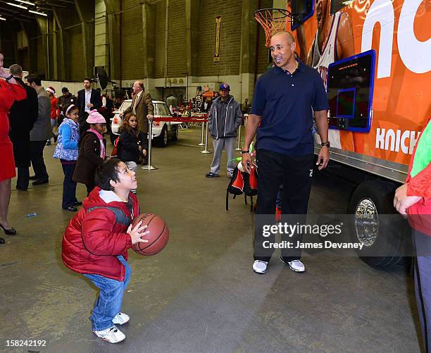 John Starks attends the 3rd Annual Garden of Dreams Foundation & Delta Air Lines' 'Holiday in the Hangar' event at John F. Kennedy International...