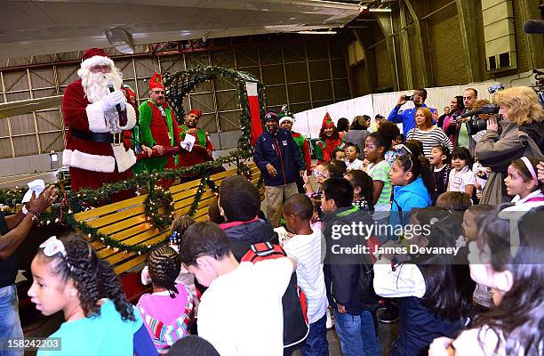 Guests attend the 3rd Annual Garden of Dreams Foundation & Delta Air Lines' 'Holiday in the Hangar' event at John F. Kennedy International Airport on...