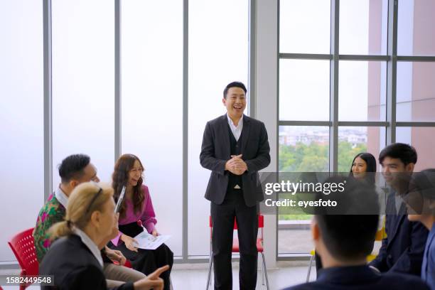 employees are meeting and making group engagement. - diverse town hall meeting stock pictures, royalty-free photos & images
