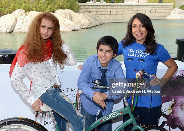 Actors Waad Mohammed, Abdulrahman al Guhani and director Haifaa Al Mansour attend the "Wadjda" photocall during day four of the 9th Annual Dubai...