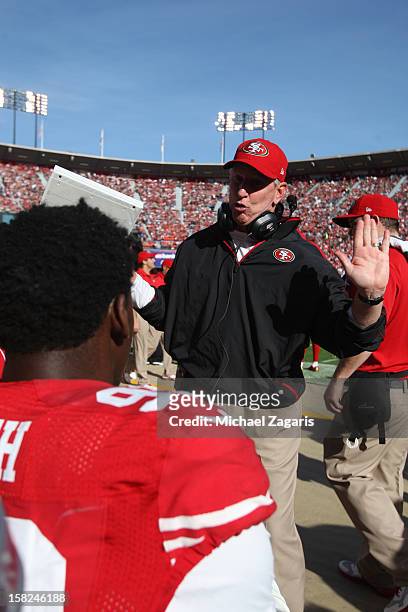 Linebackers Coach Jim Leavitt of the San Francisco 49ers talks with Aldon Smith during the game against the Miami Dolphins at Candlestick Park on...