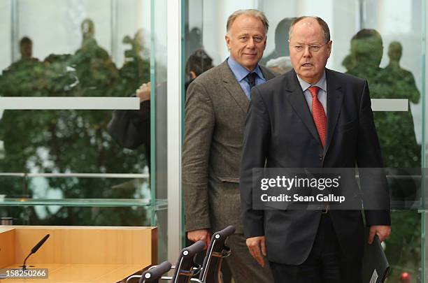 German Greens Party co-chancellor candidate Juergen Trittin and German Social Democrats chancellor candidate Peer Steinbrueck arrive to present a...