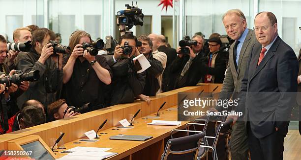 German Greens Party co-chancellor candidate Juergen Trittin and German Social Democrats chancellor candidate Peer Steinbrueck arrive to present a...