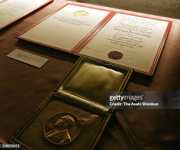 The certificate and medal of the Nobel Prize in Medicine laureate Shinya Yamanaka are seen ahead of the Nobel Prize Award Ceremony at Concert Hall on...
