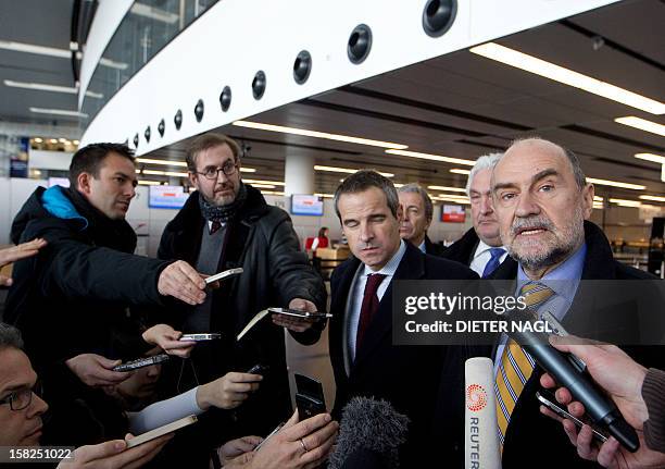 Deputy Director General and Head of the Department of Safeguards Herman M.G. Nackaerts speaks to journalists with his team as he leaves to another...