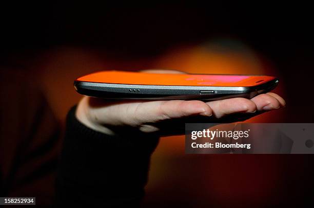 The new Galaxy Nexus phone is displayed at a Sprint Nextel Corp. Event during the 2012 International Consumer Electronics Show in Las Vegas, Nevada,...