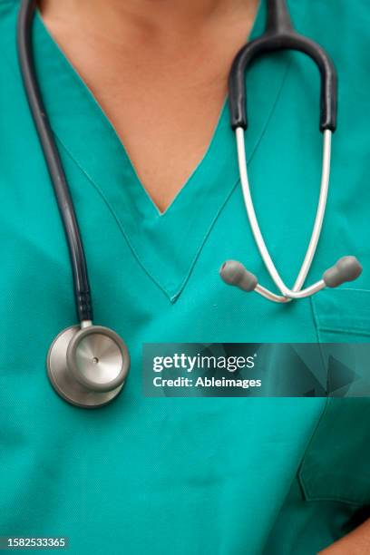 close up of a doctor chest with stethoscope - torso stock pictures, royalty-free photos & images