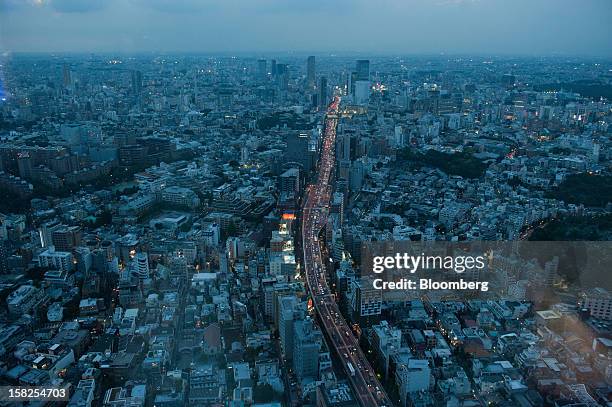 Traffic moves along an expressway in this elevated view of Tokyo, Japan, on Saturday, Oct. 6, 2012. The world's finance ministers and central bank...