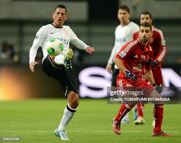 Brazil's Corinthians midfielder Ralf controls the ball beside Egypt's Al Ahly forward Abdallah Said during their 2012 Club World Cup semi-final...