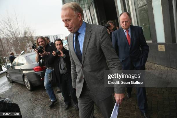 German Greens Party co-chancellor candidate Juergen Trittin and German Social Democrats chancellor candidate Peer Steinbrueck depart after presenting...