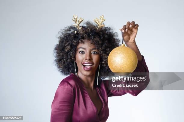 excited woman celebrating xmas - christmas party dress stock pictures, royalty-free photos & images