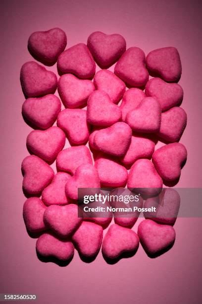 still life pink heart candy on pink background - candy hearts stock pictures, royalty-free photos & images