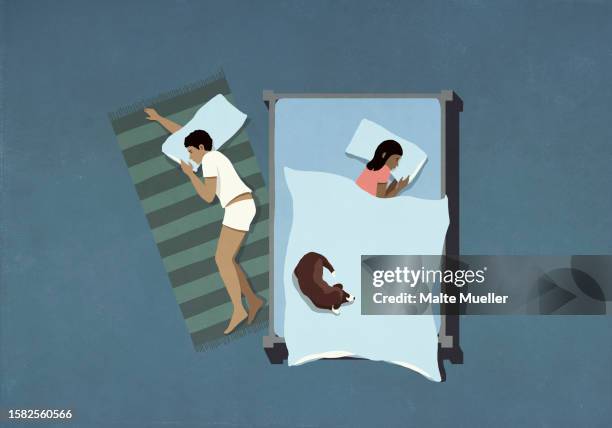 view from above husband sleeping on floor below wife and dog in bed - flooring stock illustrations