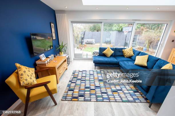 property interiors - navy blue living room stock pictures, royalty-free photos & images