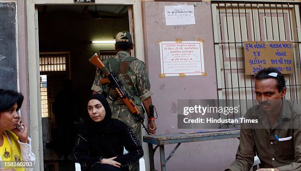 Central Reserve Police Force deployed at polling station for the 1st phase of Gujarat state assembly elections on December 12, 2012 in Surat, India....