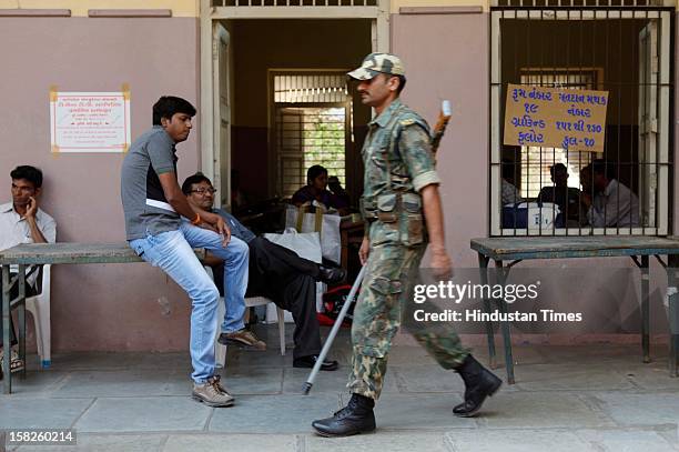 Central Reserve Police Force at Polling stattion for the 1st phase of Gujarat state assembly elections on December 12, 2012 in Surat, India. Polls in...