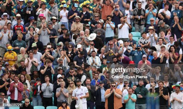 Chris Woakes of England is applauded by the crowd following the end of their over during Day Five of the LV= Insurance Ashes 5th Test Match between...