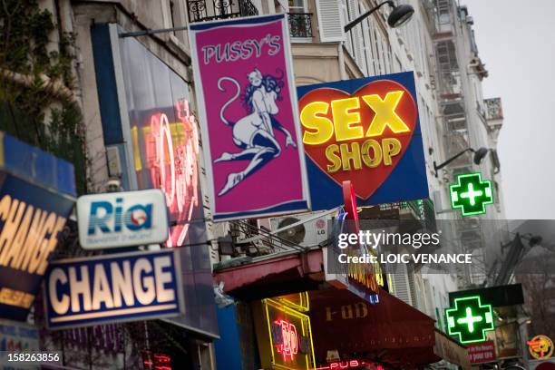 Picture taken on January 12, 2011 shows sex shops at the Paris district of Pigalle. AFP PHOTO LOIC VENANCE