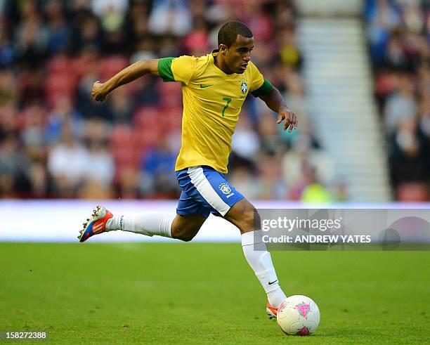 Brazilian midfielder Lucas Moura controls the ball during the London 2012 Olympic games warm up football match between Great Britain and Brazil at...