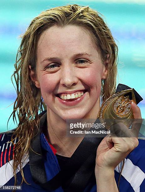 Hannah Miley of Great Britain poses with her gold medal from her victory in the Women's 400m IM final during day one the FINA World Short Course...