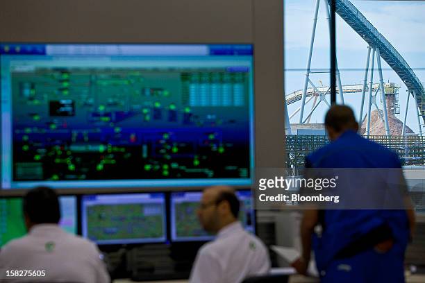 Engineers and technicians work in the control room at the Eldorado Celulose e Papel S.A processing plant in Tres Lagoas, Brazil, on Wednesday, Dec....