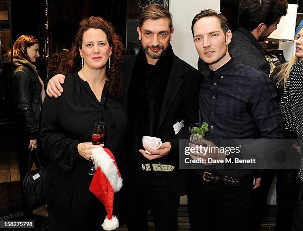 Rebecca Ward, David Waddington, Dan Gillespie Sells attend a Christmas drinks hosted by designer Nicholas Kirkwood to celebrate his partnership with...