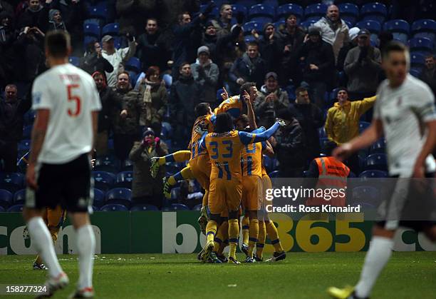 John Dempster of Mansfield Town is congratulated after scoring the opening goal during the FA Cup with Budweiser Second Round replay match between...