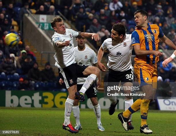 John Dempster of Mansfield Town gets in a header during the FA Cup with Budweiser Second Round replay match between Mansfield Town and Lincoln City...