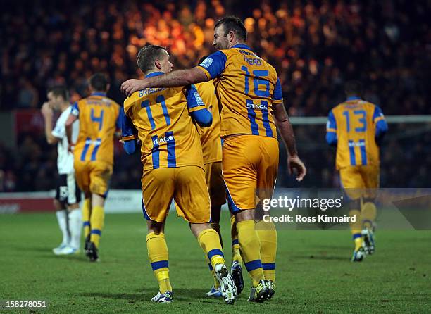 Louis Briscoe of Mansfield celebrates after he scores their second goal during the FA Cup with Budweiser Second Round replay match between Mansfield...