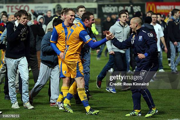 Louis Briscoe and Lee Beevers of Mansfield celebrate after the FA Cup with Budweiser Second Round replay match between Mansfield Town and Lincoln...