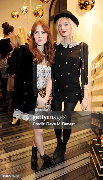 Angela Scanlon and Sophie Sumner attend a Christmas drinks hosted by designer Nicholas Kirkwood to celebrate his partnership with Chambord black...