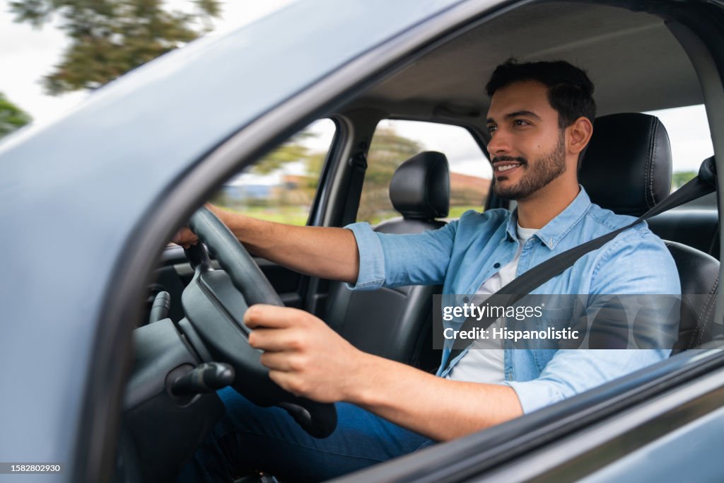 Happy man driving his car
