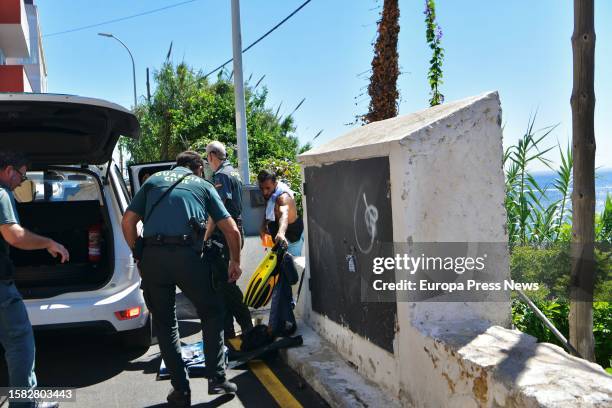 Civil Guard officers after intercepting two Syrian migrants on the coast of Ceuta, in the Sarchal neighborhood, July 31 in Ceuta, Spain. The Guardia...