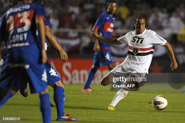 Lucas of Brazil's Sao Paulo drives the ball against Argentina's Tigre during their Copa Sudamericana football final match at Morumbi stadium in Sao...