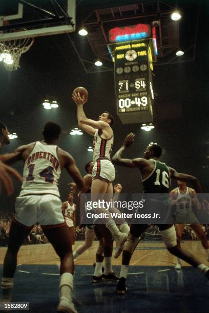 Jerry Lucas of the Cincinnati Royals drives to the basket for a layup against the Boston Celtics during the NBA game in Cincinnati, Ohio. NOTE TO...