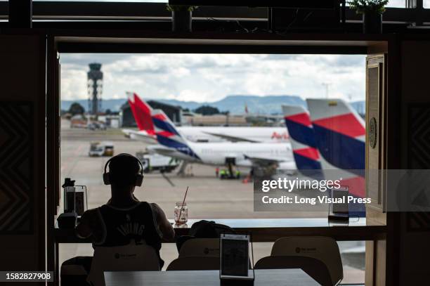 People wait for their departures at Bogota's El Dorado International Airport in Colombia, July 28, 2023.